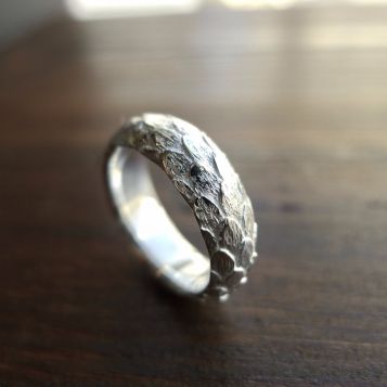 Irish jewellery - Extreme close up of a handcrafted silver dragon ring with texturing